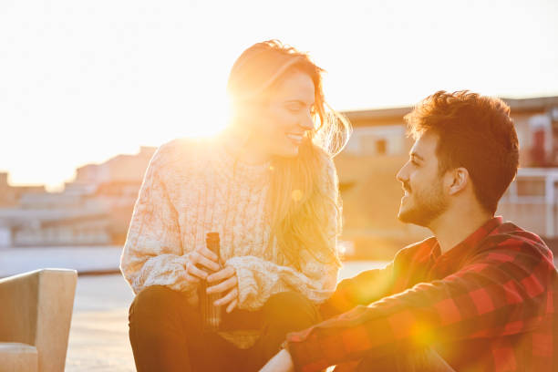 istock Couple talking on rooftop during sunny day 846394690