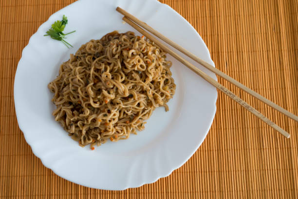 istock Yakisoba / noodles with beef in rectangle plate with bamboo stic 846394718