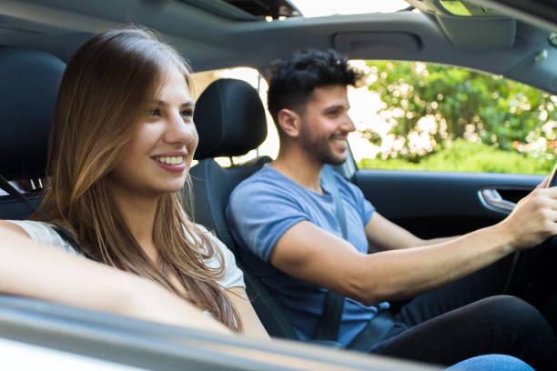 istock Happy couple driving in a car 846395374