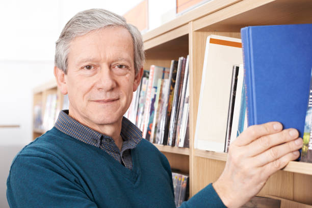 istock Portrait Of Mature Male Student Studying In Library 846397930