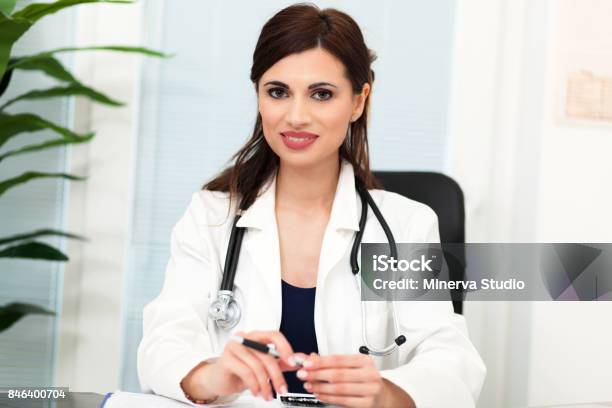 Smiling Female Doctor At Work Stock Photo - Download Image Now - 25-29 Years, Adult, Adults Only