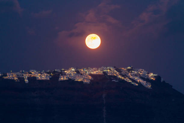 istock Full moon over Imerovigli town on Santorini island, Greece. 846401392