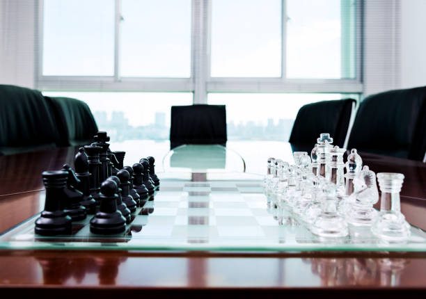 istock Chess pieces and board on the conference table 846401918
