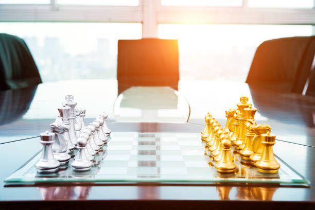 istock Chess pieces and board on the conference table 846406158