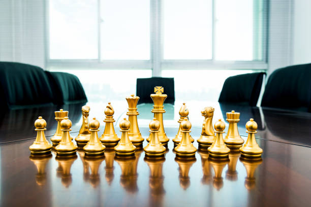 istock Golden pieces on the conference table 846406380