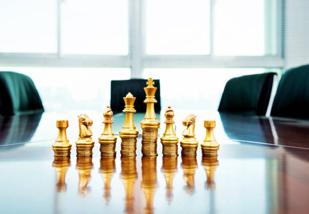 istock Chess pieces standing on the stacked coins 846406450