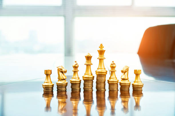 istock Chess pieces standing on the stacked coins 846406496