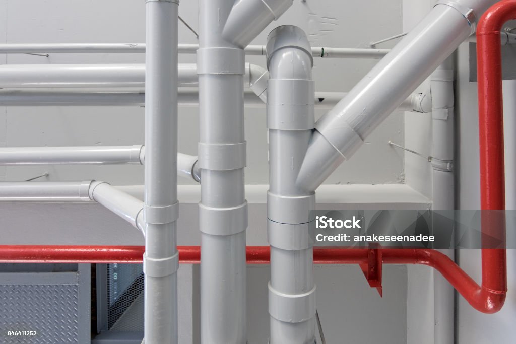 pipe system in building pipe system red and white in building Pipe - Tube Stock Photo