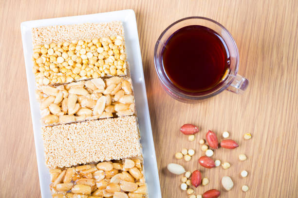 Collection of Beans Candies and Sweets Sweets ( Mawlid Halawa ) with Cup of Red Tea - Egyptian Culture Dessert usually Eaten During Prophet Muhammad Birth Celebration