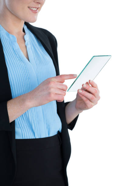 istock Mid section of smiling businesswoman wearing suit using glass interface 846411806