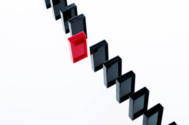istock The red domino stands out 846414388