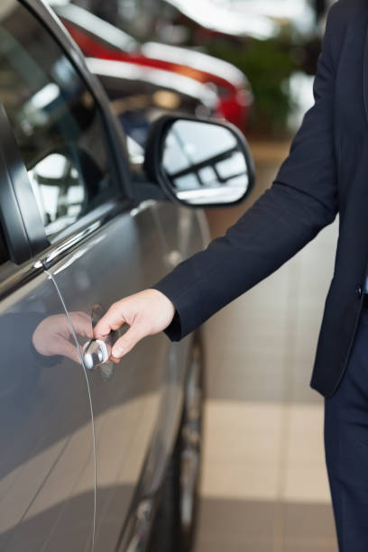 istock Man holding a car door handles 846415166