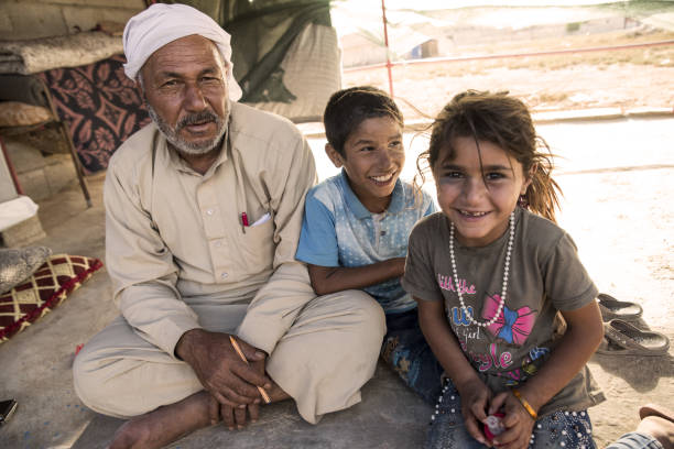 Akcakale, Turkey - September 6, 2017: Syrian people in unofficial refugee camp in Akcakale. These people are refugees from Idlib, Rakka and Aleppo and escaped because of Syrian civil war.