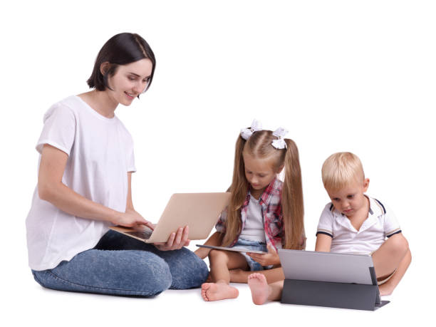 istock A beautiful woman joining her children to modern technologies isolated on a white background. 846418748