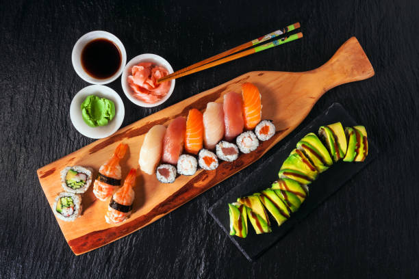Set of sushi and maki on stone table. Top view with copy space