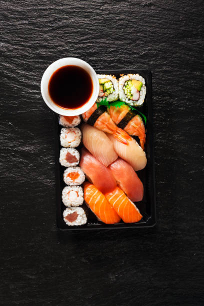 istock Set of sushi and maki on stone table. Top view with copy space 846418858