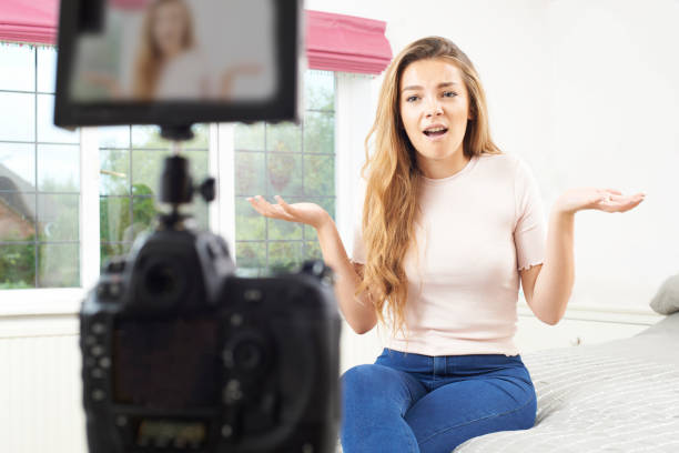 istock Female Vlogger Recording Broadcast In Bedroom 846418902
