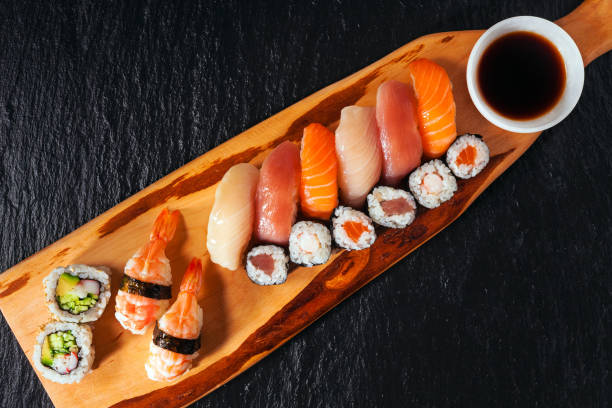 istock Various kinds of sushi served on a platter with soy sauce, wasab 846418958