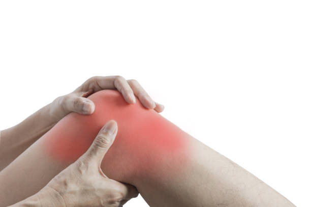 Body pain. close-up female body with pain in knees. Woman hands touching and massaging painful knee. stock photo