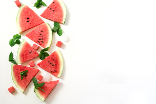 Slice of watermelon, mint ice on a white background.