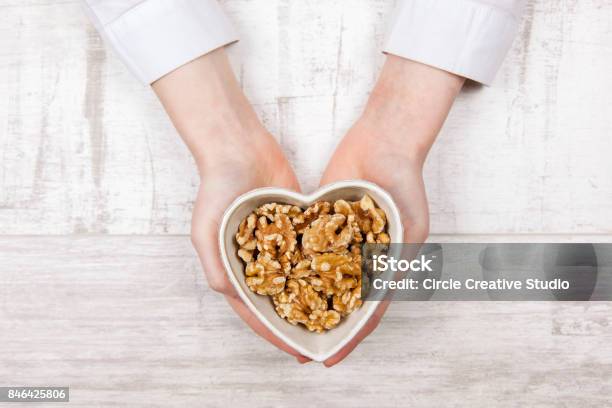 Walnuts In Woman Hands Stock Photo - Download Image Now - Walnut, Nut - Food, Eating