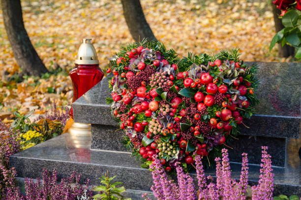 all saints day in the autumn cemetery stock photo