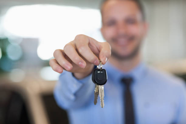 istock Man holding car keys by his fingertips 846436976