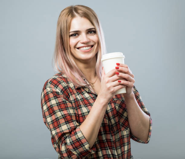 istock Cheerful young girl with coffee 846437812