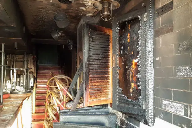 Photo of Burned entrance to the bar, broken windows, attack of drunken hooligans