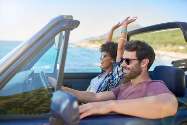 istock Young couple roadtrip on covertible car 846440268