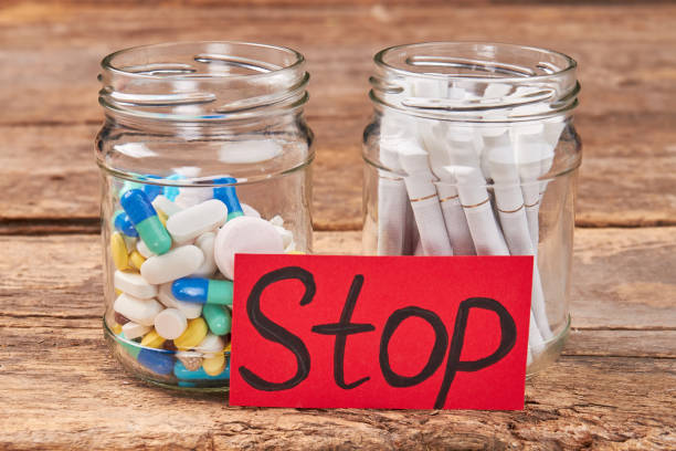 istock Pills, tobacco cigarettes, message stop. 846440332