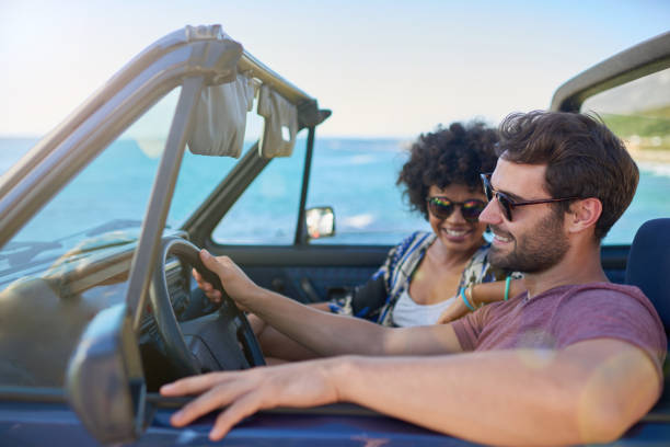 istock Young couple roadtrip on covertible car 846440370
