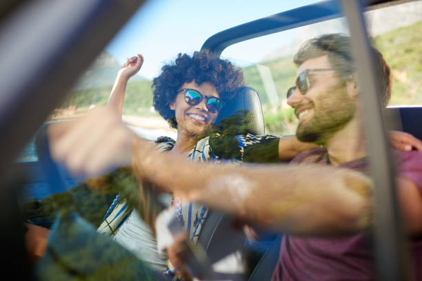 istock Young couple roadtrip on covertible car 846440470