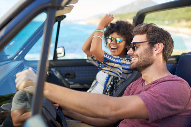 istock Young couple roadtrip on covertible car 846440556