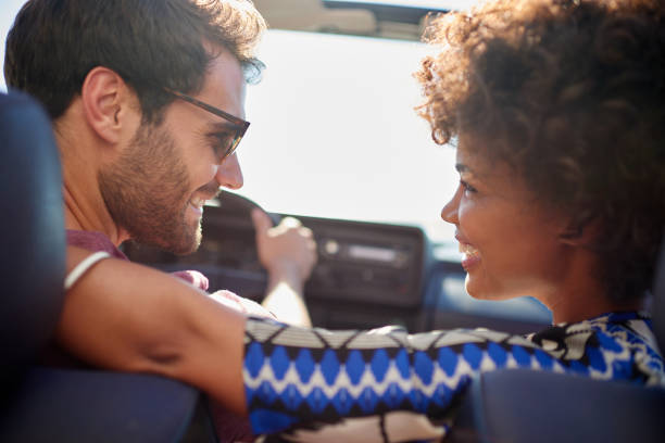istock Young couple roadtrip on covertible car 846440644
