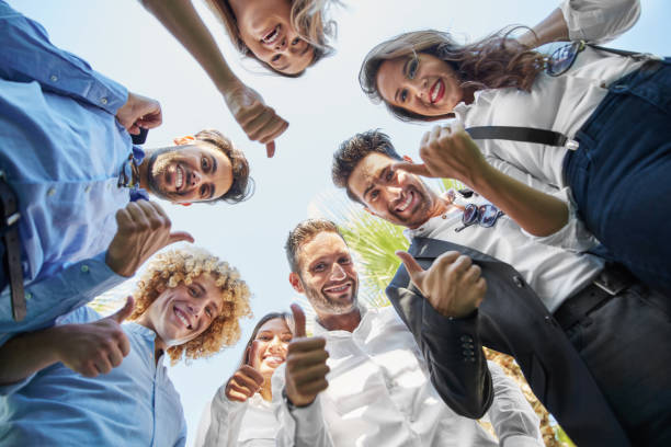 istock Business people standing in circle showing thumbs up 846440764