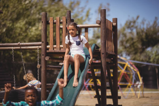 istock Girl playing on slide 846441700