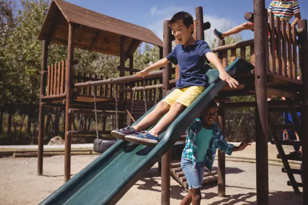 Photo of Kids playing on slide