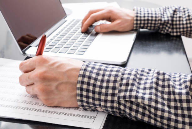 istock Man reviewing report in office 846443996