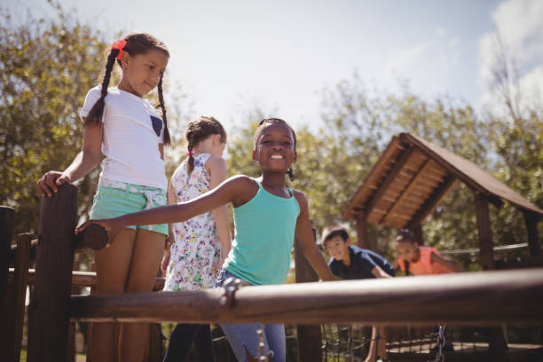 istock Happy schoolkids playing in playground 846444288