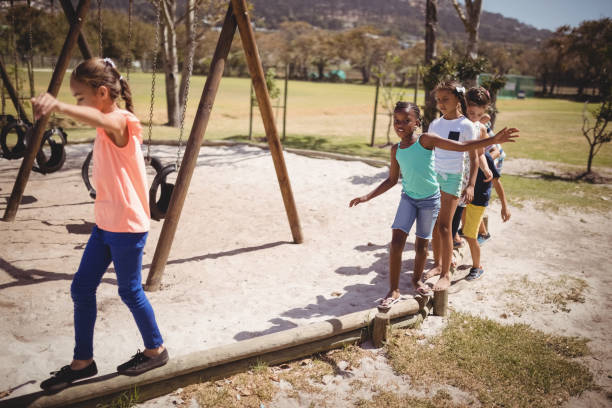 istock Happy schoolkids playing in playground 846444530