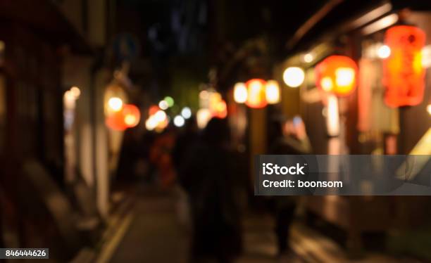 Abstract Blur Wooden Store And Restaurant With Lighted Lanterns Stock Photo - Download Image Now