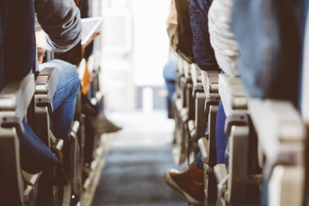 istock Interior of airplane with people travelling 846458404