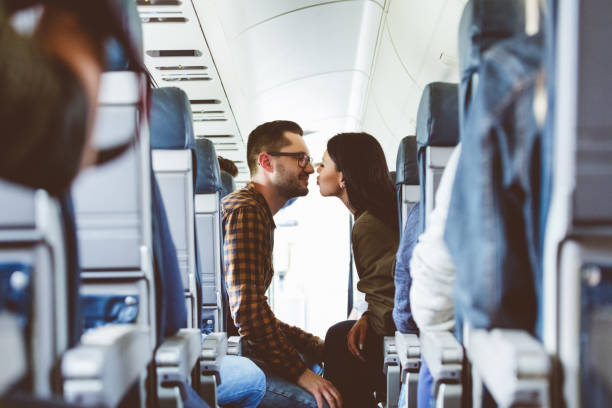 Couple in love traveling by airplane