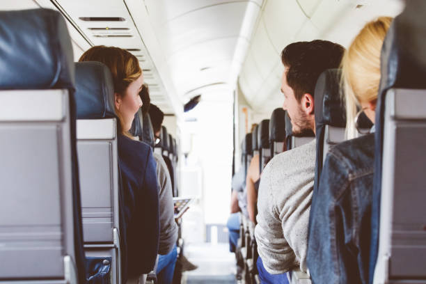 istock Commercial airliner cabin with people travelling 846461764