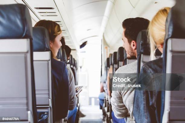 Commercial Airliner Cabin With People Travelling Stock Photo - Download Image Now - Adult, Aerospace Industry, Air Vehicle