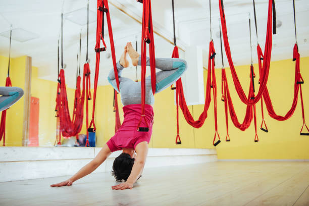 istock young woman making antigravity yoga exercises 846463174
