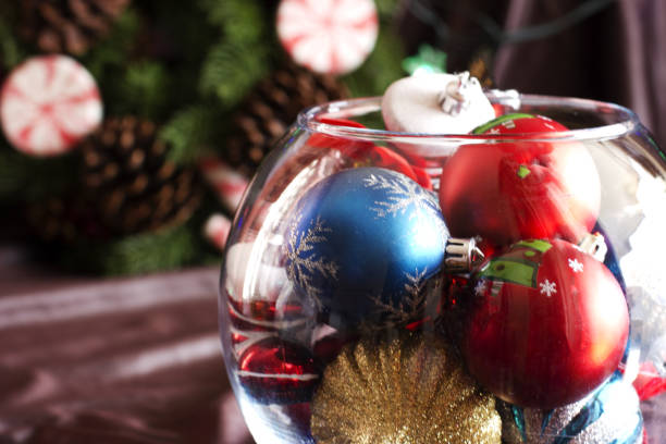 istock Christmas tree toys in a round glass vase 846466476