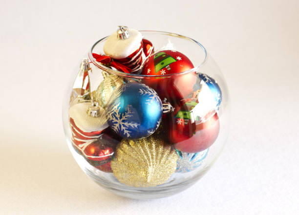 istock Christmas tree toys in a round glass vase 846466524