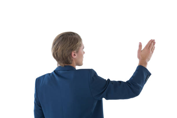 istock Rear view of businessman gesturing during presentation 846469496